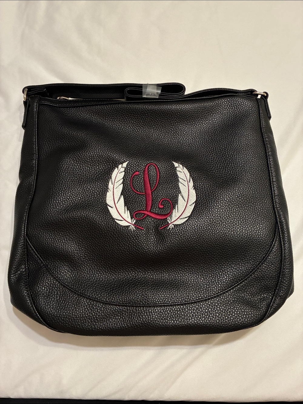 BLACK BEAUTY PEBBLE Shoulder Bag with “L” Monogram and White Feather